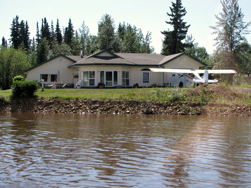 AK2 July6 House along river with plane in backyard (fairly typical)