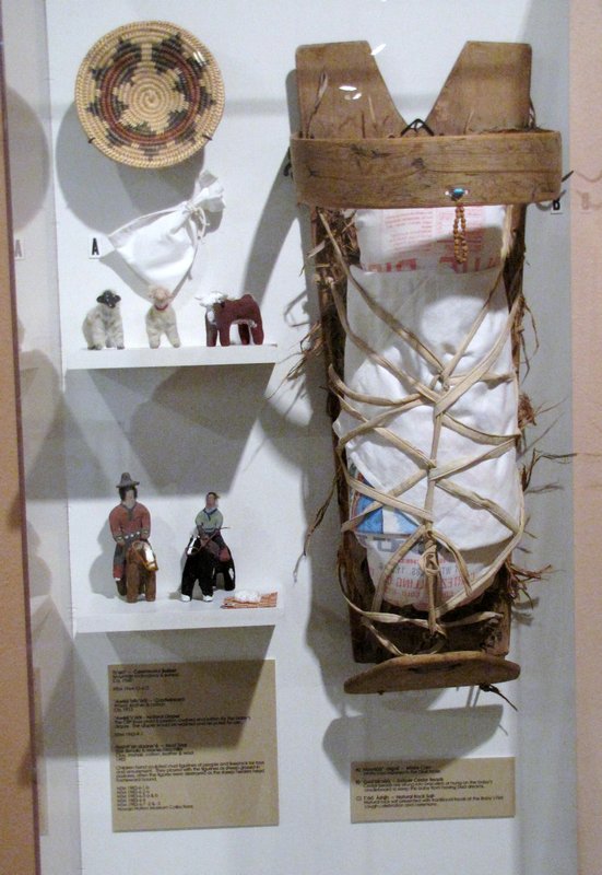 512-21 Cradle board and other items at Navajo Museum