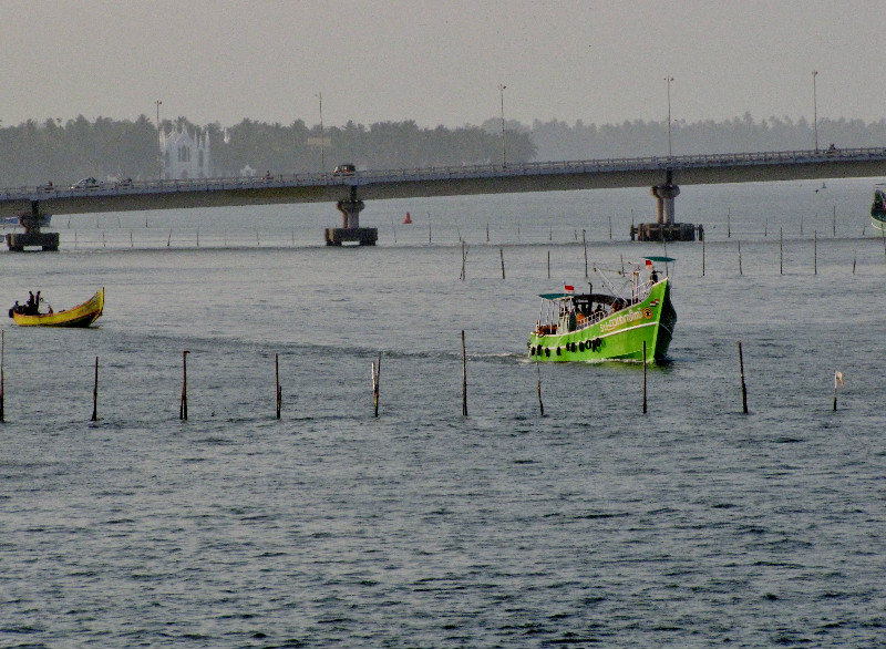 1304-159 Two colorful fishing boats cutting across the bay