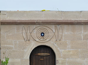 1305-231 An evil eye over kitchen entrance to cafe--to ward off evil entering the building