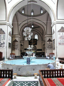 1305-297 The main mosque of Bursa--the disputed fountain area (note man washing before prayers)