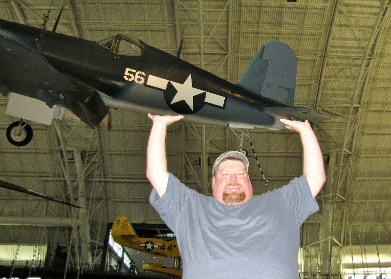 1307-29 David Brown supporting his favorite plane--Vought F4U-1D Corsair