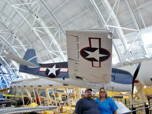1307-58 Dave and Heather (our cousins) with a Grumman F6F-3 Hellcat in background