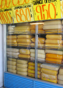 1312-572 Huge blocks of cheese in storage at market