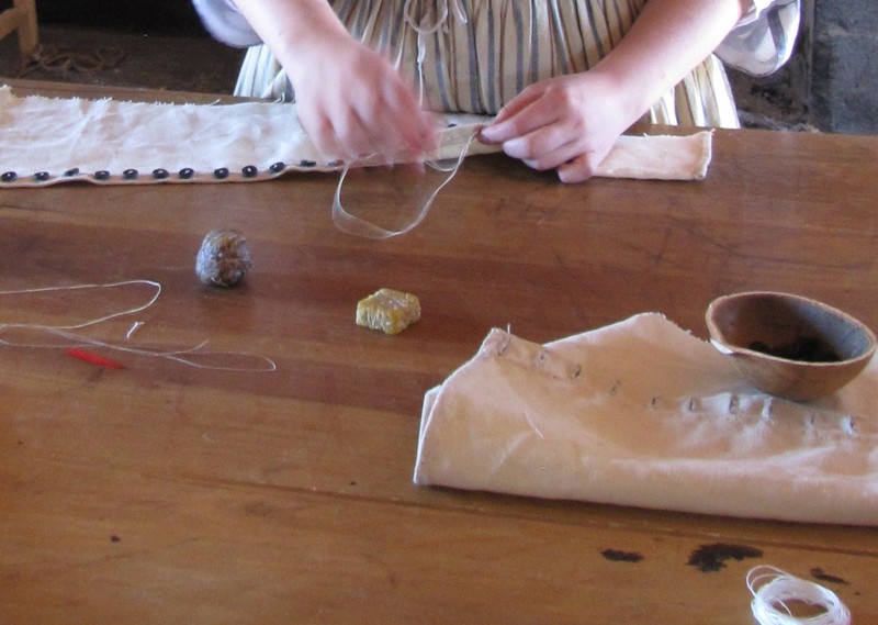 1506-32 Seamstress making a woolen legging