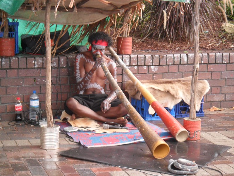 Street performer playing Digeridoo