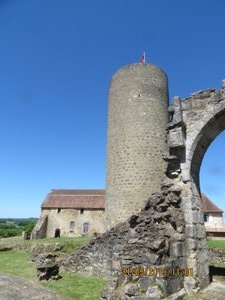 Chapel and tower remains, the keep and farm to the rear