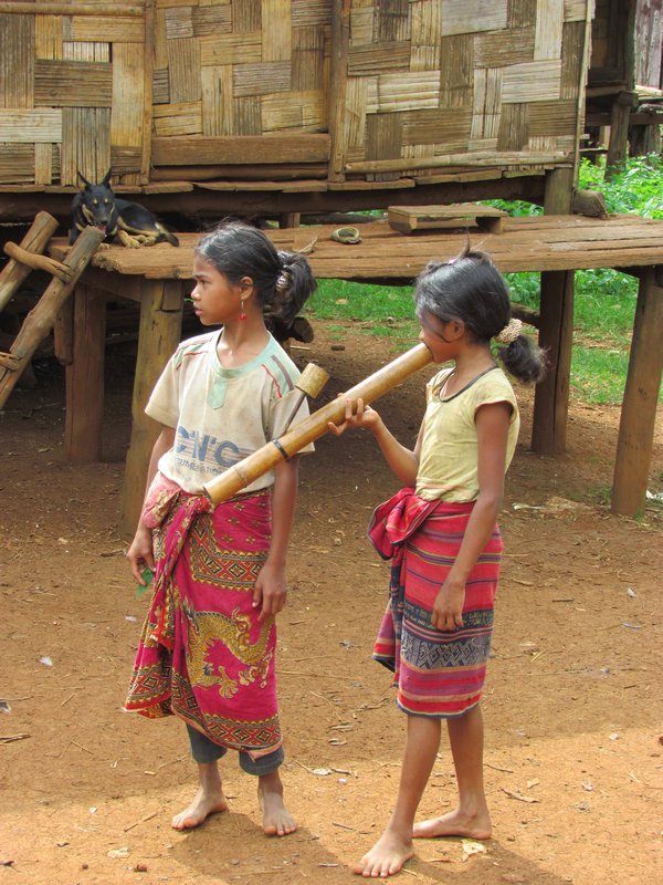 Local children complete with bamboo pipe