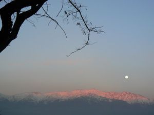 Moonrise and sunset above smoggy Santiago