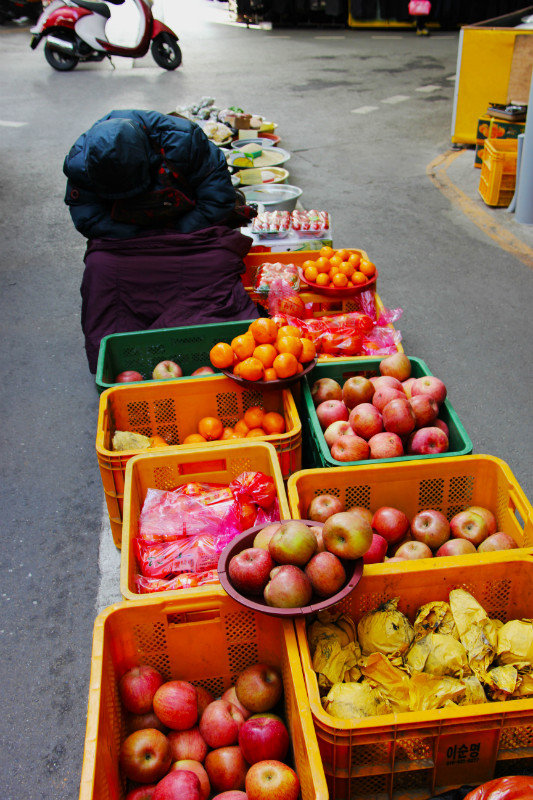 Fruit for sale, seller asleep!