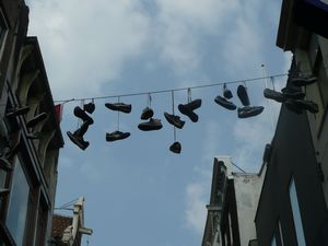 shoes hanging in Kalverstraat Amsterdam