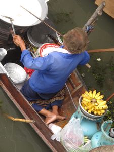 Kneeling and cooking on a boat