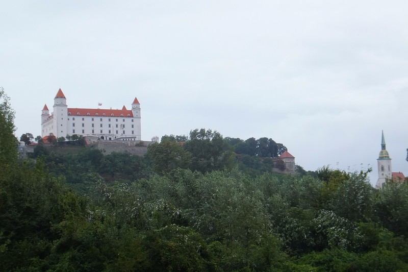 The Bratislava Castle and church spire seen from the Danube
