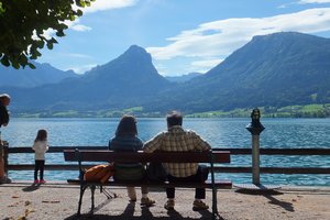 People relaxing at the lakeside of Wolfgangsee