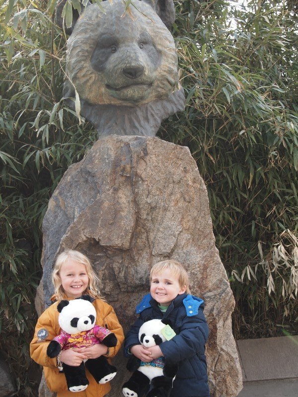 The kids with their new souvenir pandas