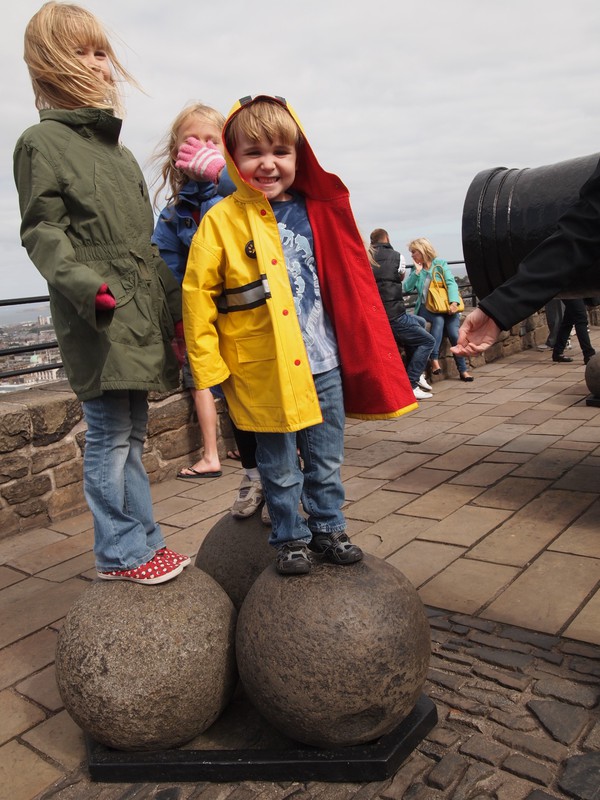 Checking out the cannon balls at Edinburgh castle.
