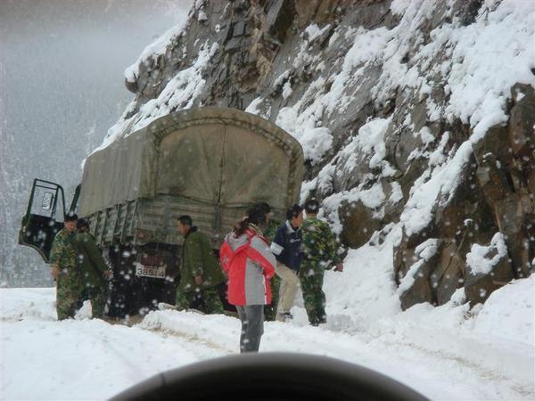 Chinese army trying to get their truck out