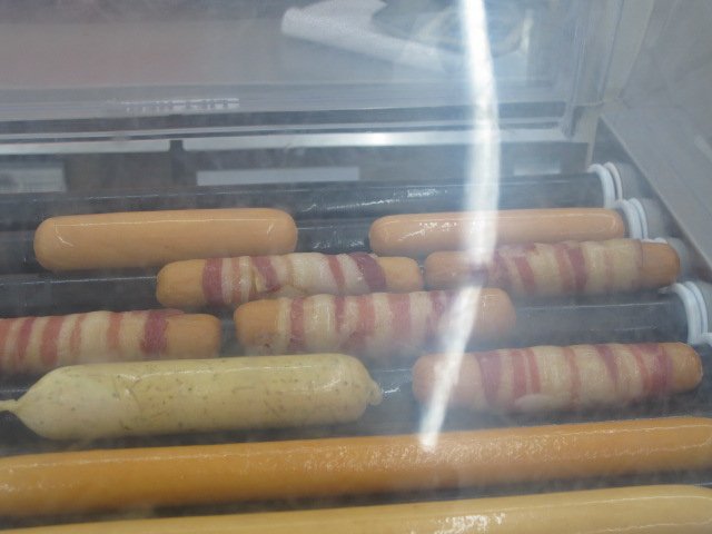 7'11 serves bacon wrapped hotdogs