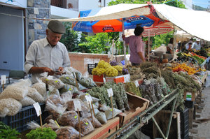 Man selling herbs in Datca Saturday market