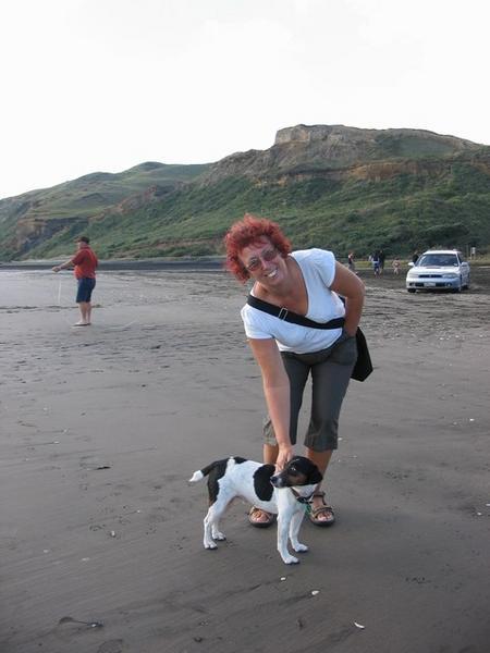 Jen with new friend on beach
