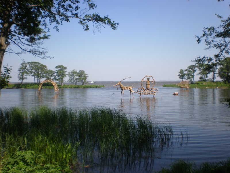 The reed sculptures on the amber lagoon