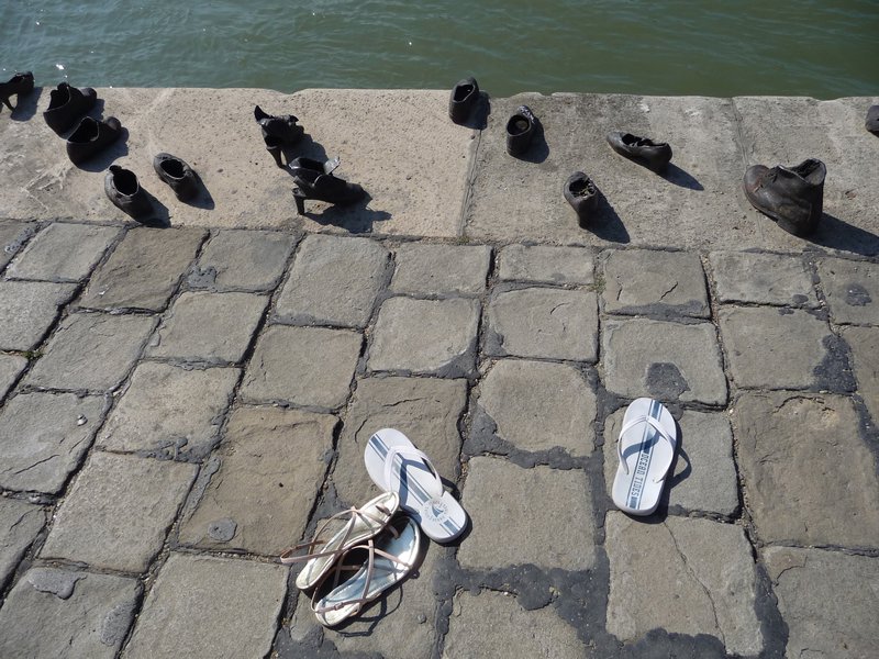 Random shoes on the side of the river