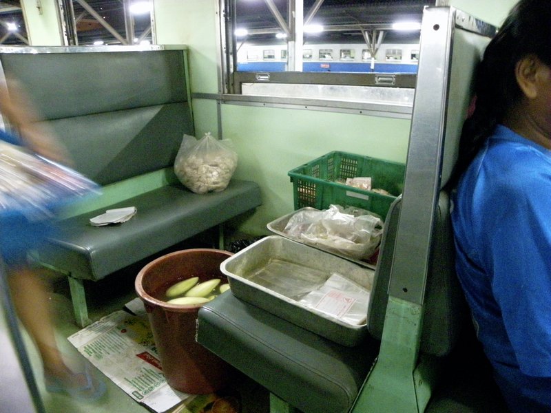 5. In the train people peeled vegies & prepared food to sell