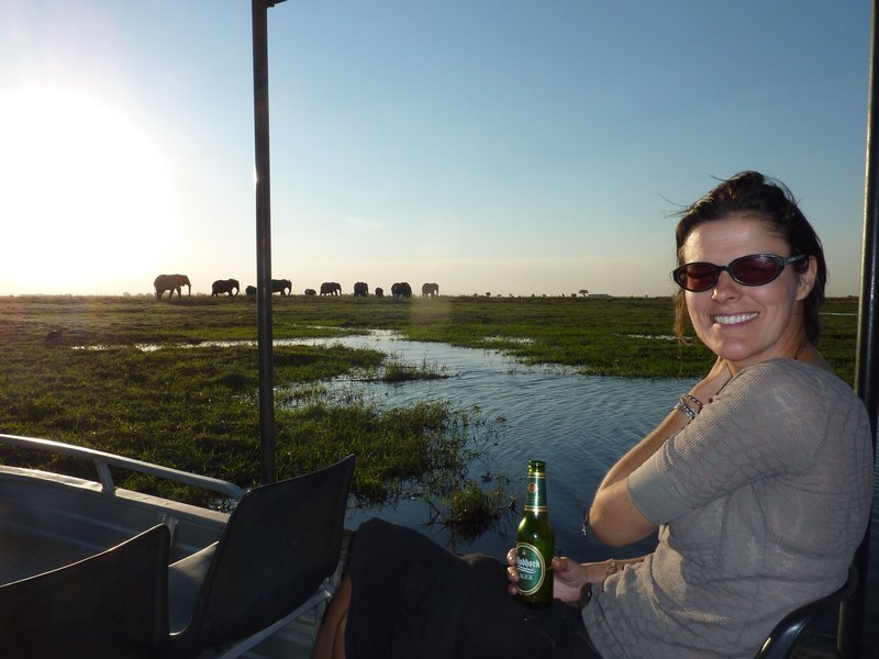 Kate looking very happy that the elephants are a long way off - or is it the cold beer