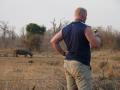 Man and Rhino contemplate life
