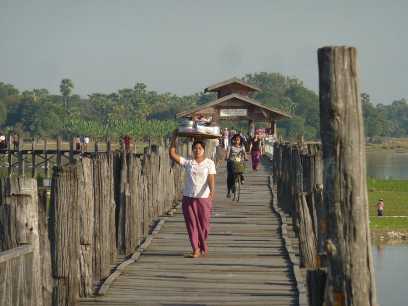 Lady crossing the bridge with snacks