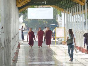 Three Monks arrive for prayer at the Kyauktawgyi