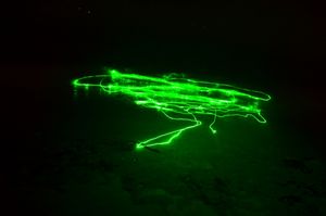 Green laser in the surf