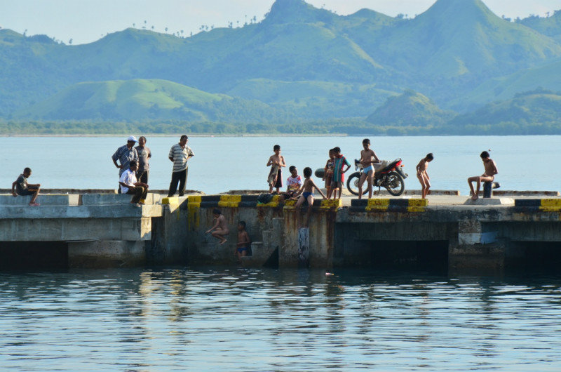Kids jumping off the port, Labuan Bajo