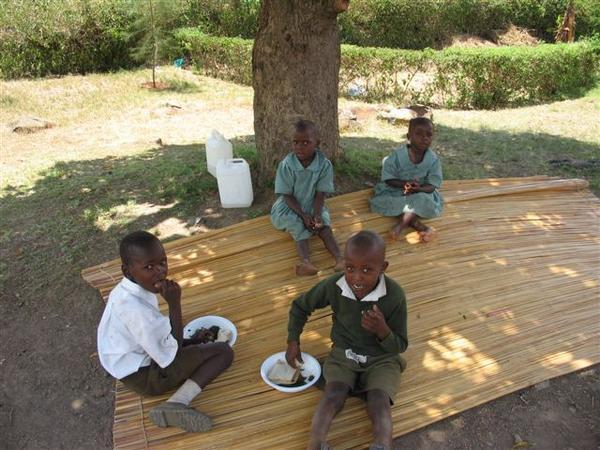 Orphans Eating Under a Mango Tree