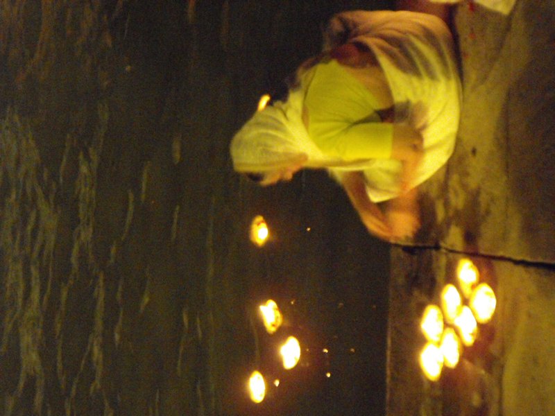 At the Hindu Festival - a woman sends prayers