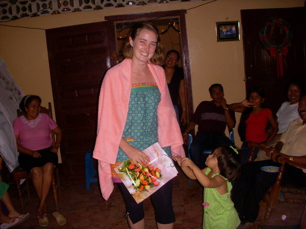 Birthday girl with presents, dancing with Ana Gabriela