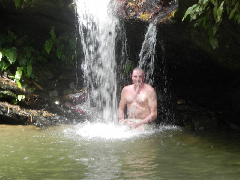 Dad in cold water waterfall