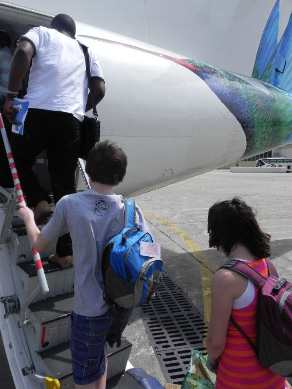 Marika and Will board flight to Tobago