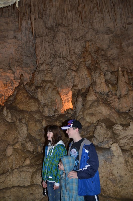The kids posing for a different picture in the cave