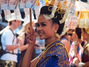 47-Beautiful thai woman asking to donate for a Charity