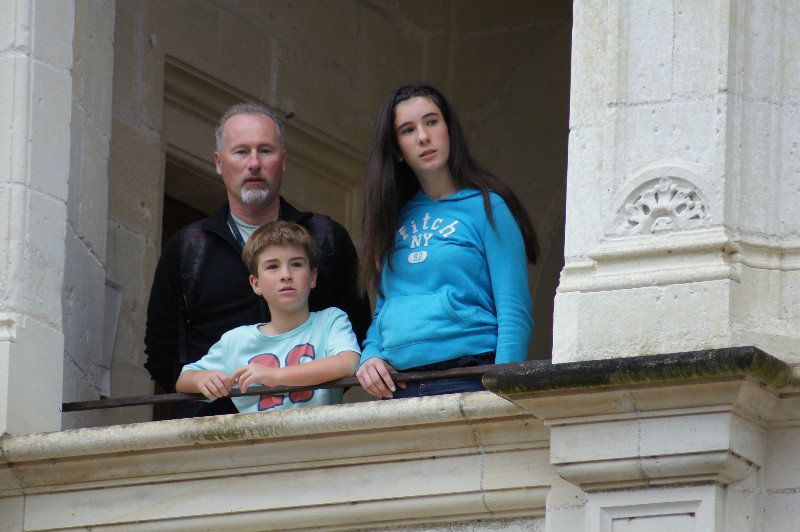 Frank, Hugo and Isabel looking out from the top floor of the chateau