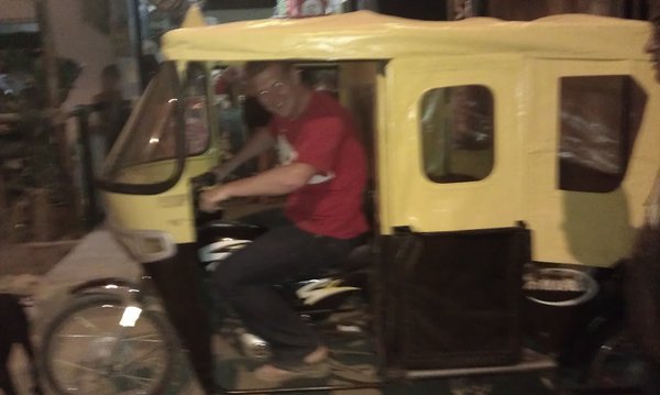 Eoghan in a mototaxi
