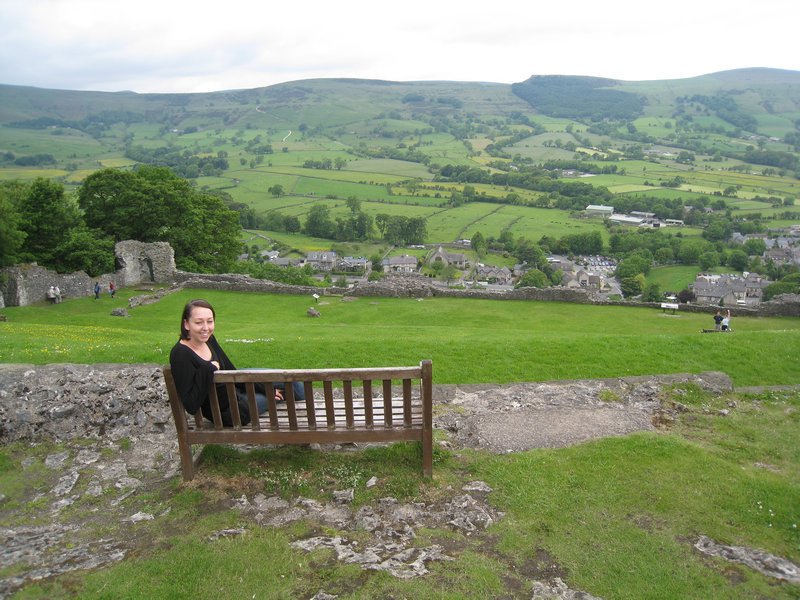 Jo in front of a view of Castleton