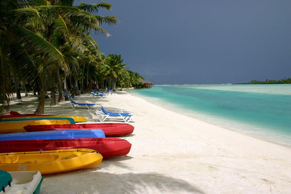 Coloured canoes along the beach