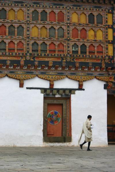 Man crosses Dzong Courtyard