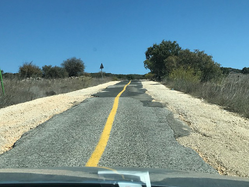 Couldn't afford to pave the whole road ?