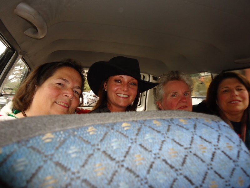 4 Grown Women in the back of a taxi