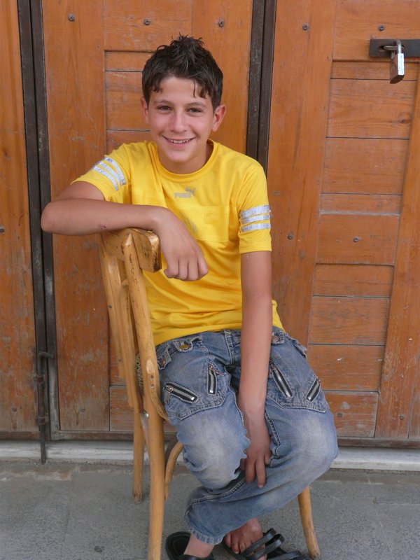 Smiley boy who helps out in the souk...