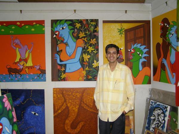 Lokesh with his paintings