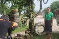 Interviewing village leader about stacking tires to prevent dengue